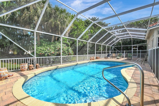 view of pool featuring a patio area and a lanai