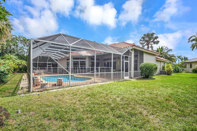 rear view of property featuring central AC, a yard, a patio, and a lanai