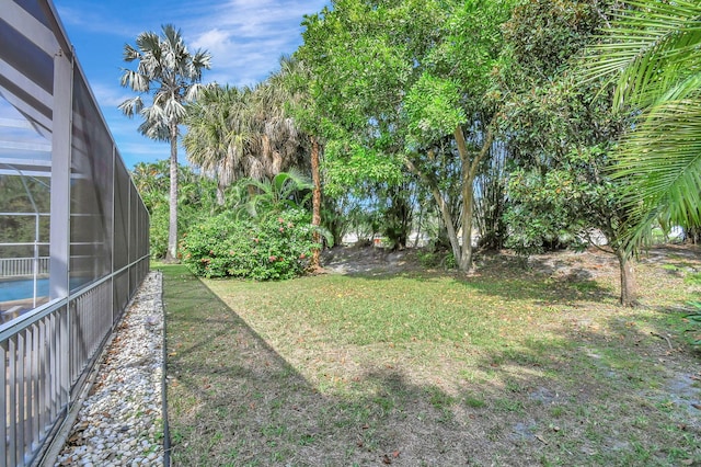 view of yard with a lanai