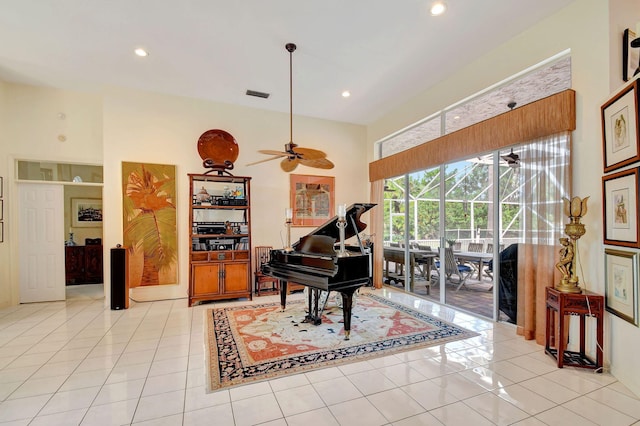 misc room with ceiling fan and light tile patterned floors