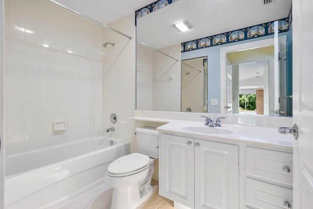 full bathroom featuring tile patterned floors, vanity, bathtub / shower combination, and toilet