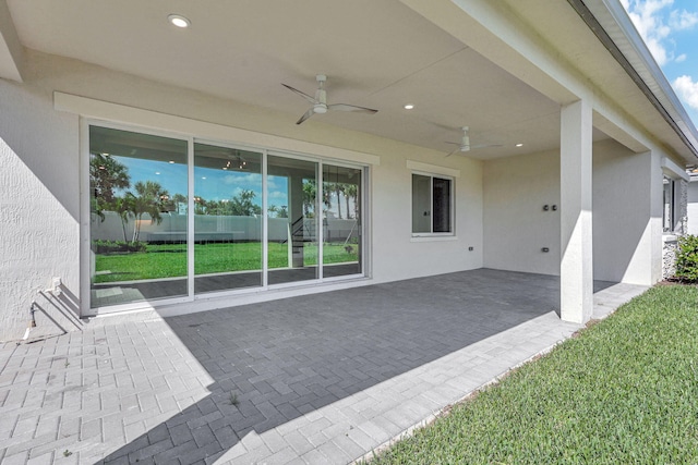 view of patio featuring ceiling fan