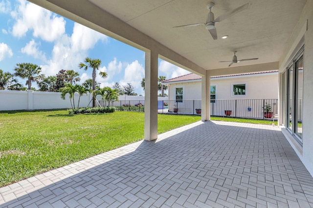 view of patio with a fenced backyard and ceiling fan