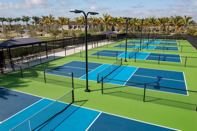 view of sport court with fence