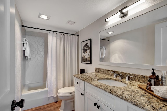 full bathroom featuring toilet, vanity, shower / tub combo, and hardwood / wood-style flooring