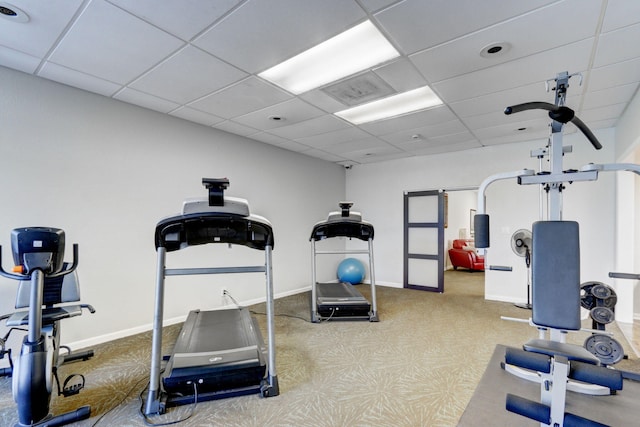 workout room featuring a drop ceiling