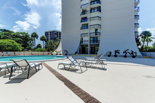 view of swimming pool featuring a patio