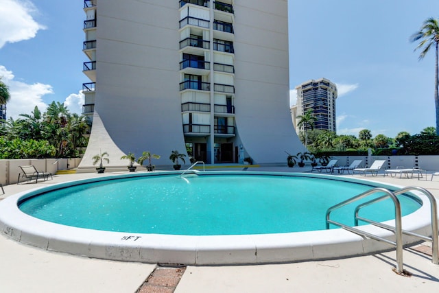 view of swimming pool featuring a patio