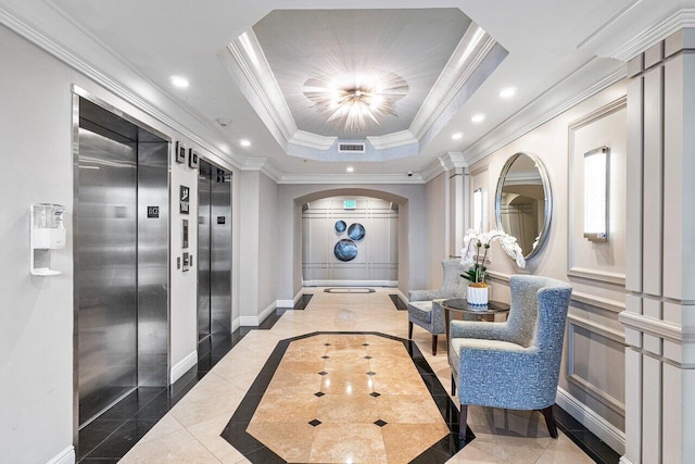 corridor featuring a raised ceiling, crown molding, and elevator