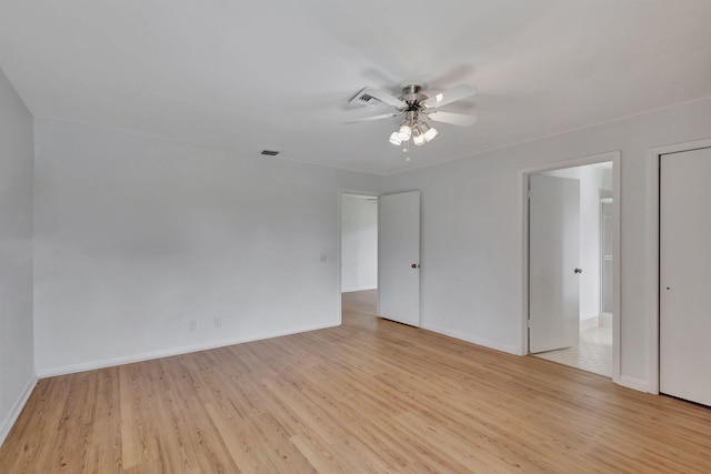 spare room with ceiling fan and light hardwood / wood-style floors