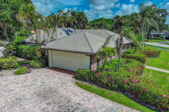 view of front of home with a garage and a front yard