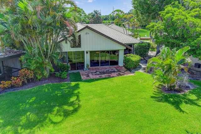 exterior space featuring a lawn and a patio area