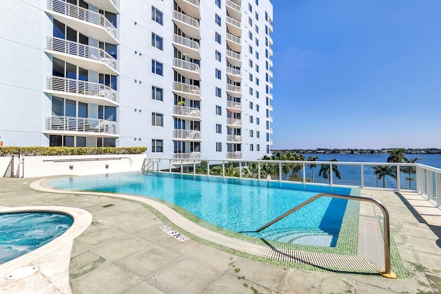 view of pool with a water view