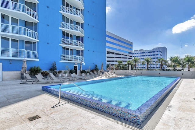 view of swimming pool featuring a patio