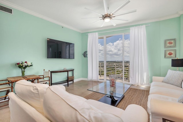 living room featuring ceiling fan and crown molding