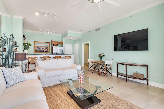 living room featuring crown molding, ceiling fan, light tile patterned flooring, and track lighting