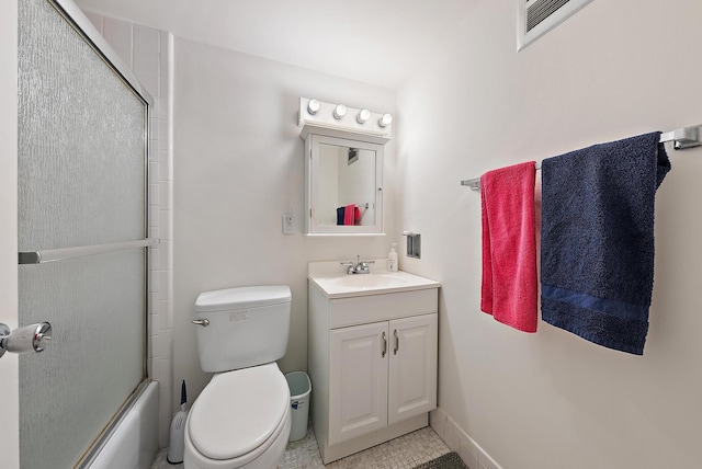 bathroom with toilet, baseboards, combined bath / shower with glass door, and vanity