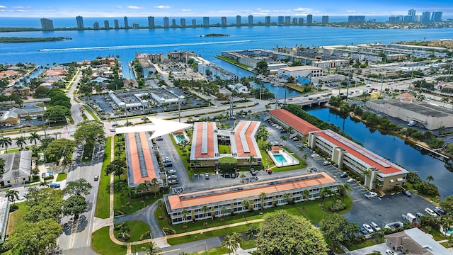 birds eye view of property featuring a view of city and a water view