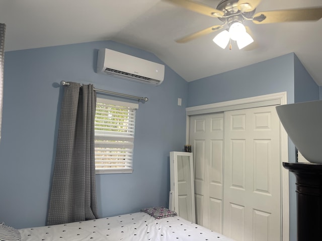 unfurnished bedroom featuring a wall mounted AC, ceiling fan, a closet, and lofted ceiling