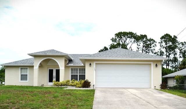 single story home featuring french doors and a front lawn