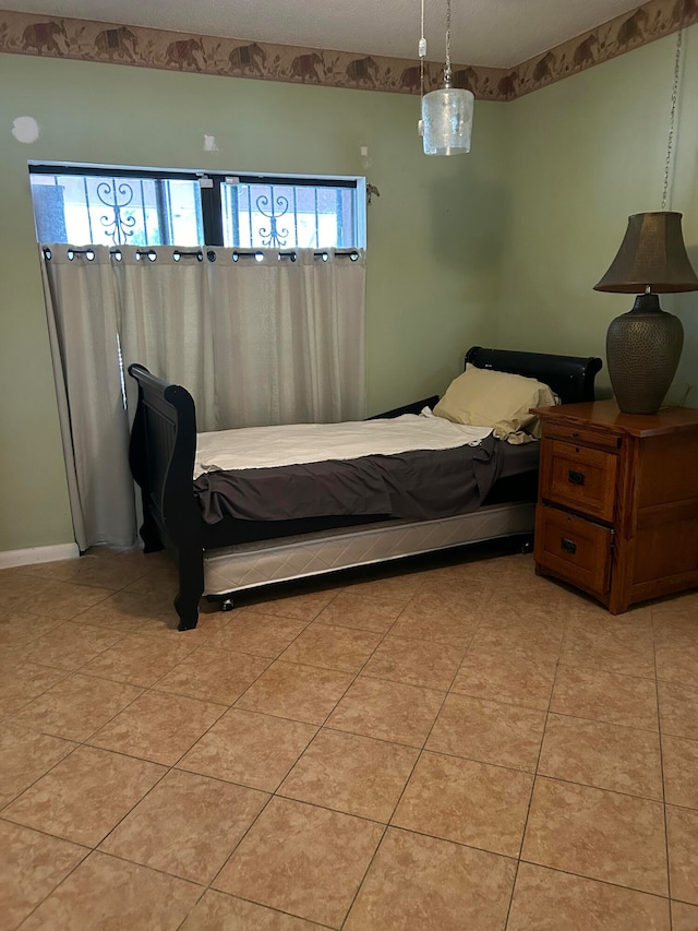 tiled bedroom with multiple windows