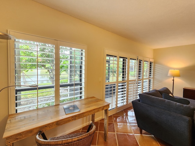 tiled dining room featuring a wealth of natural light