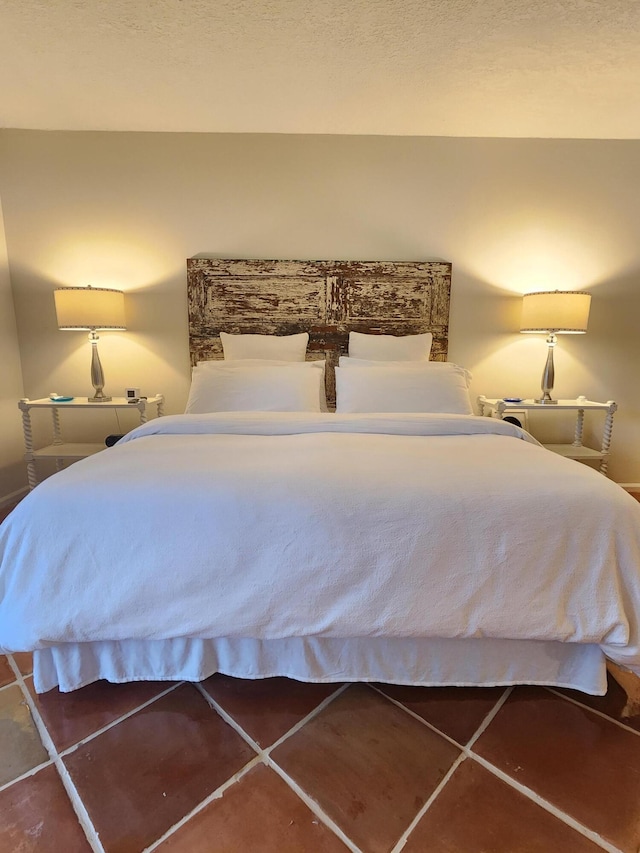 bedroom featuring tile patterned flooring