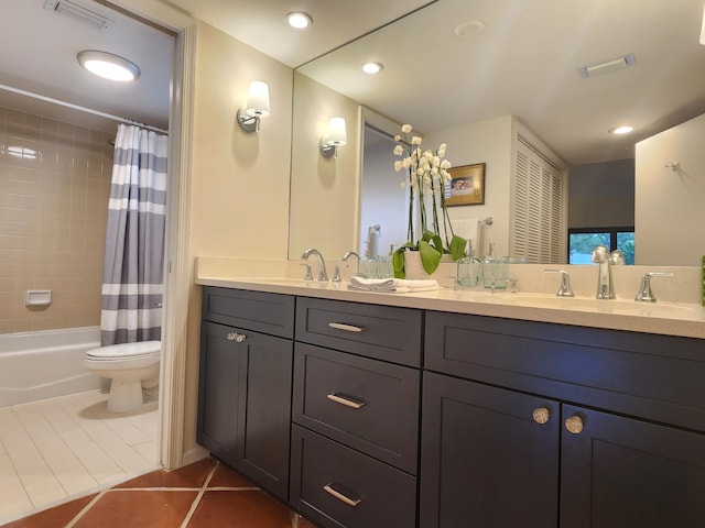 full bathroom featuring tile patterned flooring, vanity, toilet, and shower / tub combo