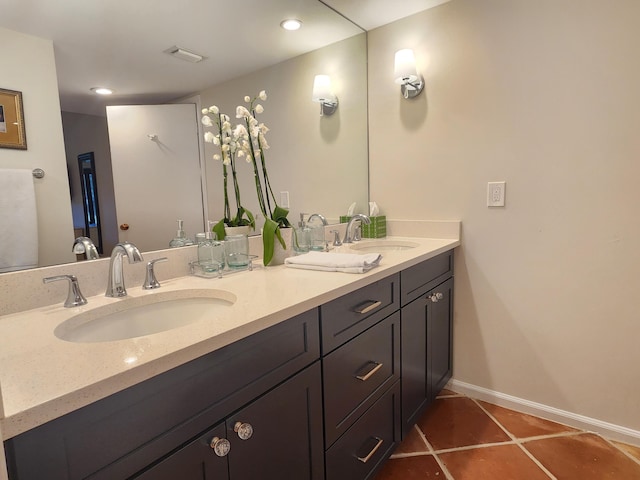 bathroom featuring tile patterned flooring and vanity