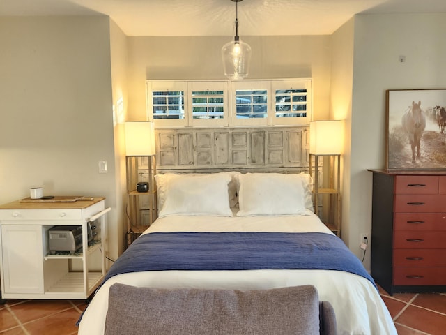 bedroom with dark tile patterned floors