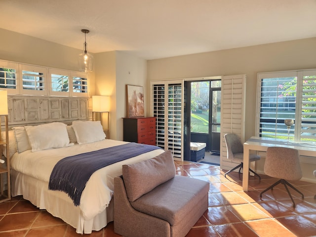 bedroom with tile patterned floors, access to exterior, and multiple windows