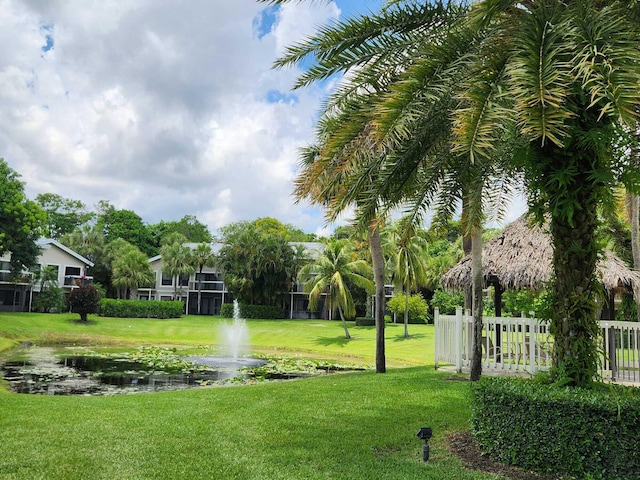 view of property's community with a lawn