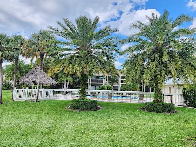 view of yard featuring a community pool