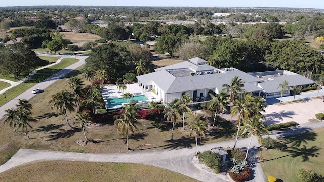 11863 Wimbledon Cir Unit 416, Wellington, FL 33414 - aerial view of property and surrounding area with a pool and a tree filled landscape