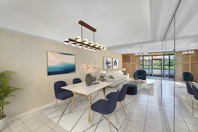 dining room with floor to ceiling windows, a chandelier, a textured ceiling, and light tile patterned floors