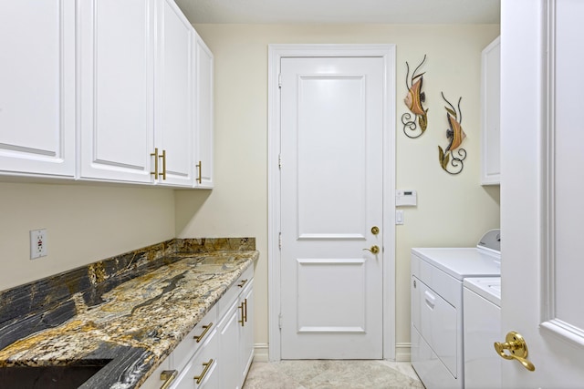 laundry room with cabinets and independent washer and dryer