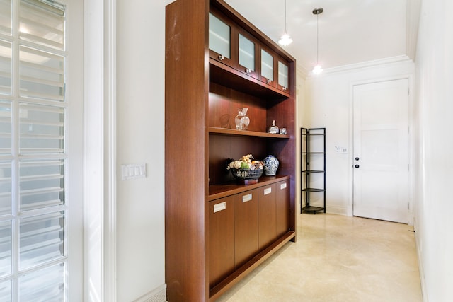 hall featuring ornamental molding