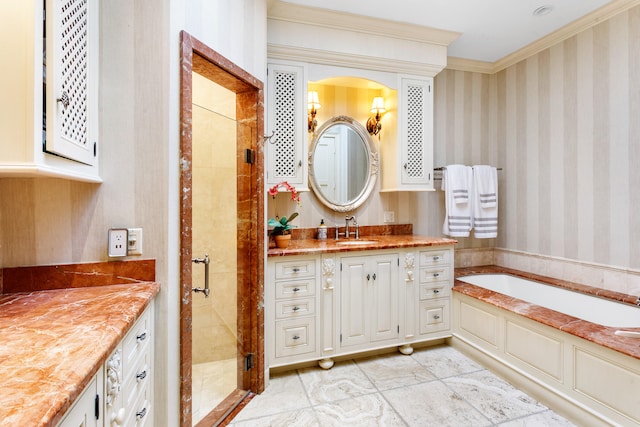 bathroom with plus walk in shower, vanity, and ornamental molding