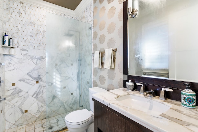 bathroom featuring vanity, toilet, a shower with door, and crown molding