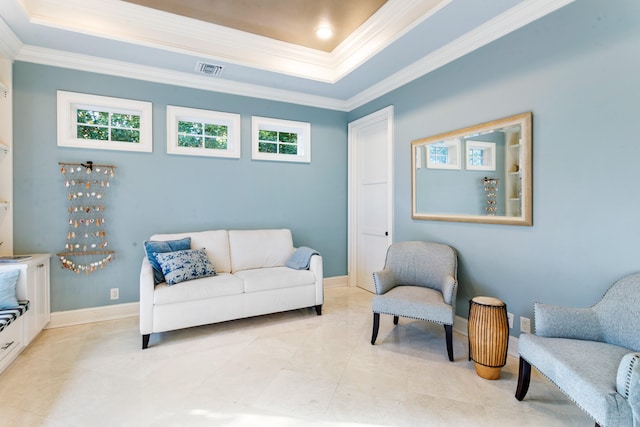 living area with crown molding, a wealth of natural light, and a tray ceiling