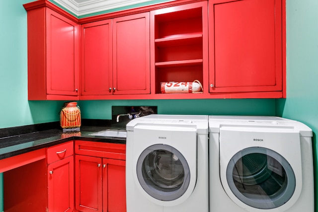 laundry room with cabinets, washer and dryer, crown molding, and sink