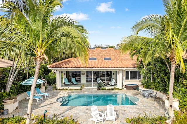 view of swimming pool with a patio