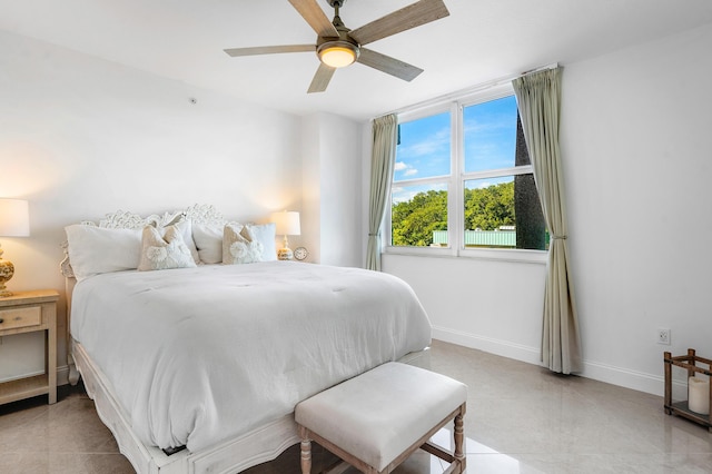 tiled bedroom with ceiling fan