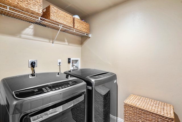 clothes washing area featuring hookup for a washing machine, separate washer and dryer, and hookup for an electric dryer