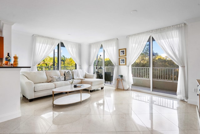 living room with plenty of natural light and light tile floors