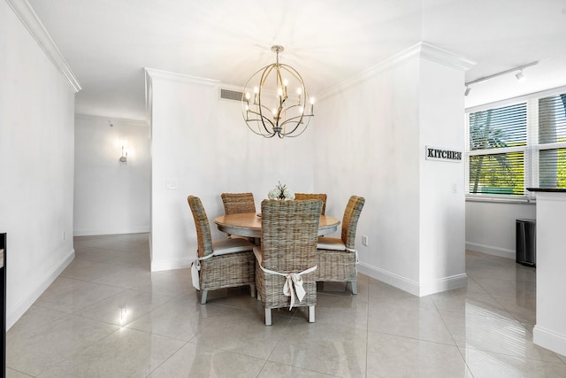 dining space featuring a notable chandelier, light tile floors, and rail lighting