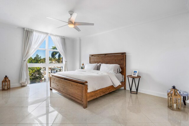 bedroom with ceiling fan, light tile floors, and crown molding