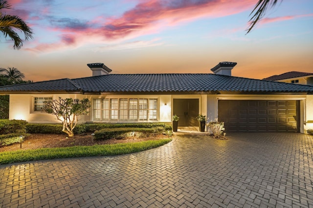 view of front of property with a garage