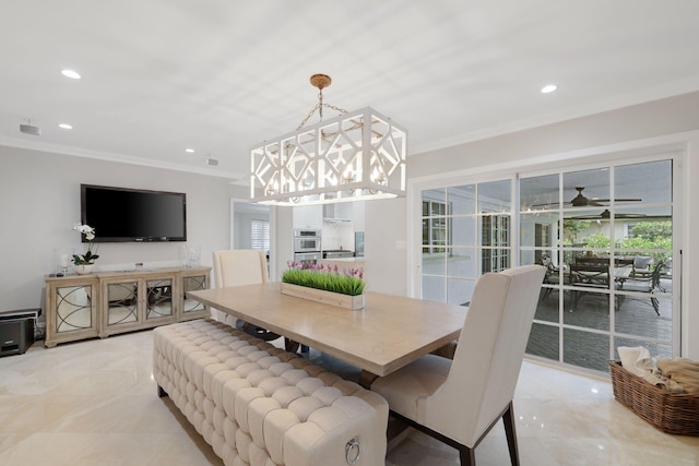 dining space featuring ceiling fan and crown molding