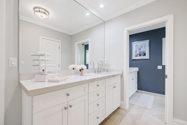 bathroom with vanity and crown molding